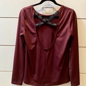 Nike Dri-Fit long sleeves. Burgundy Ladies S. Elastic back cross straps.